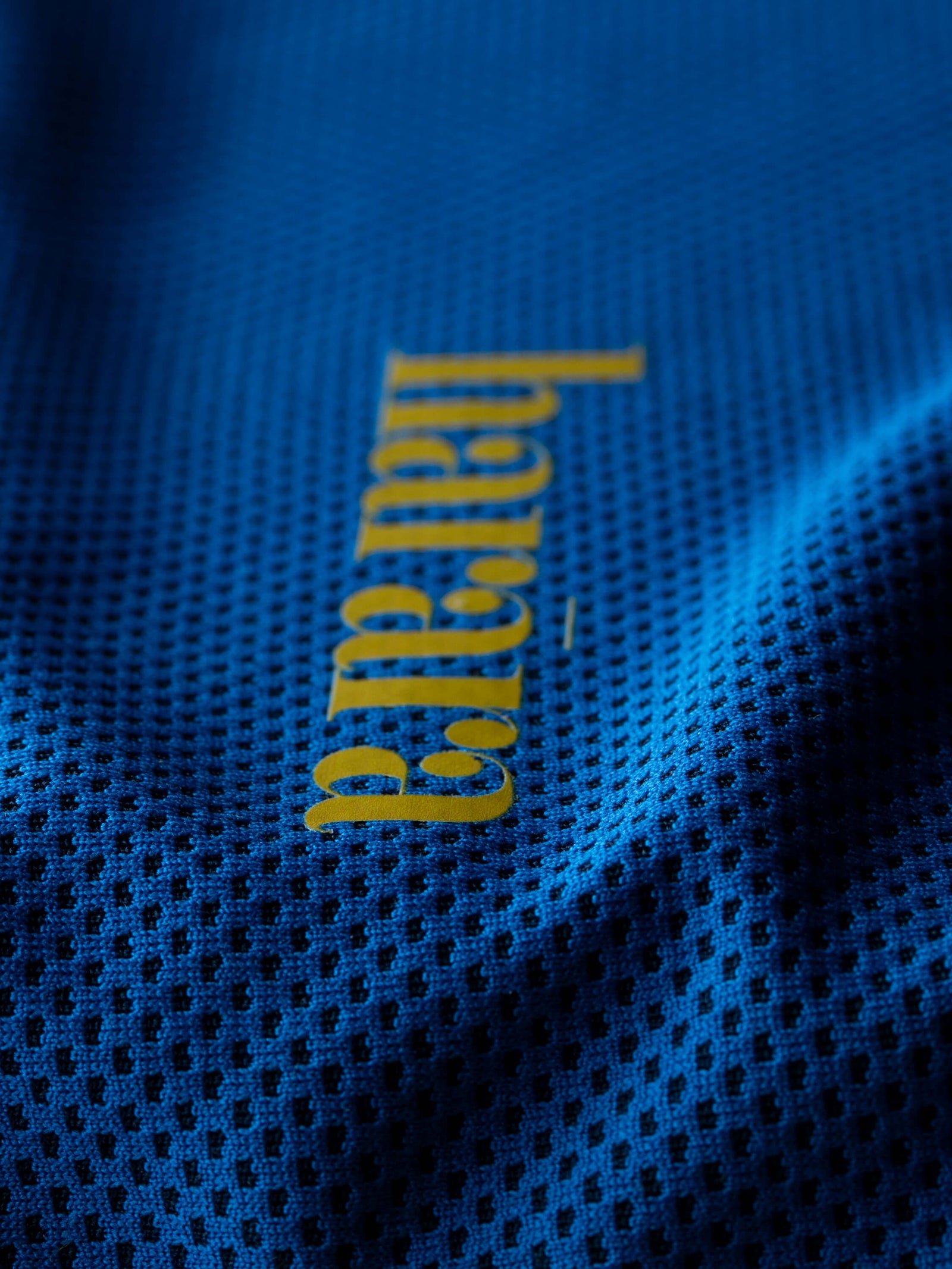 The hoodie features a branded HTV tag.