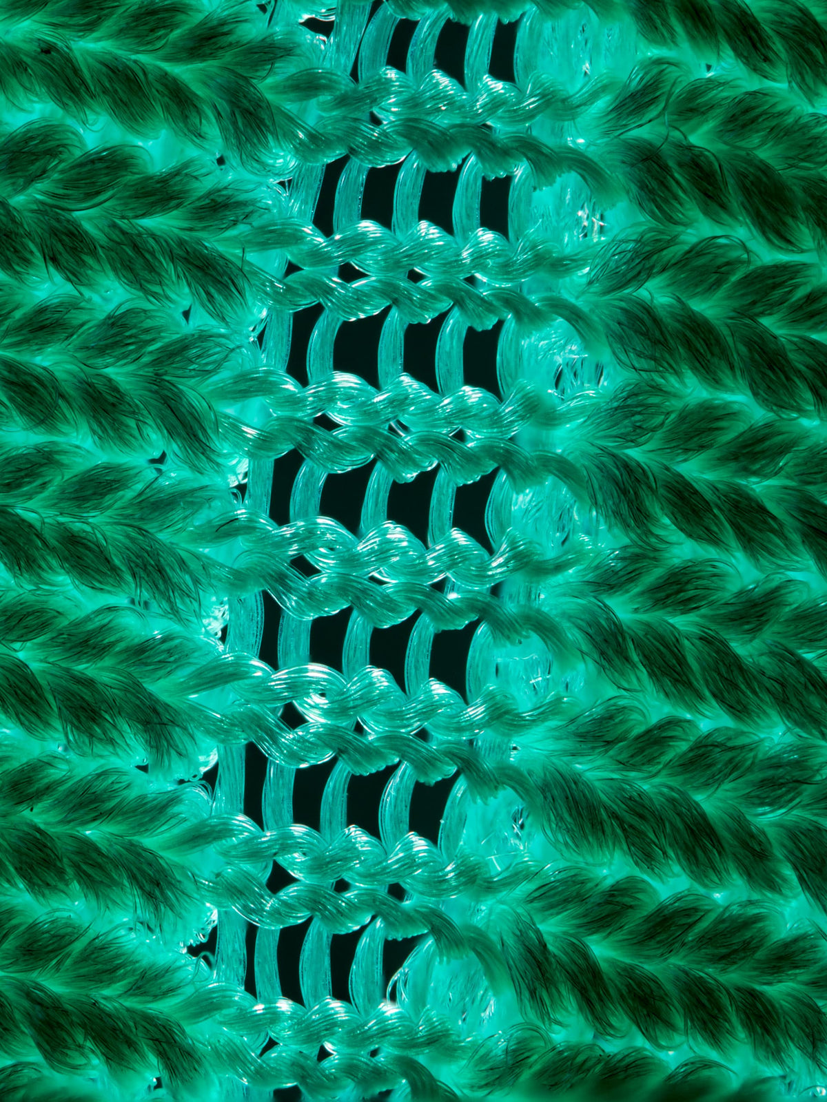 Ultra-close-up showcasing the thread fibres and knitting structure.